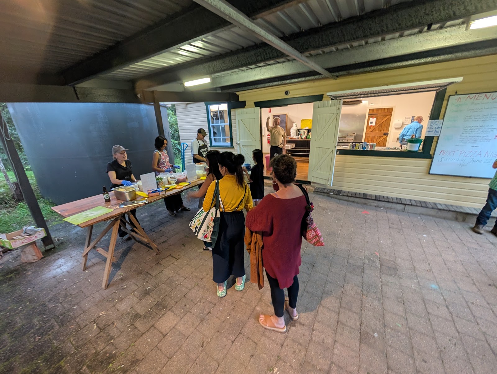 Locals lining up for pizza night at the hall servery