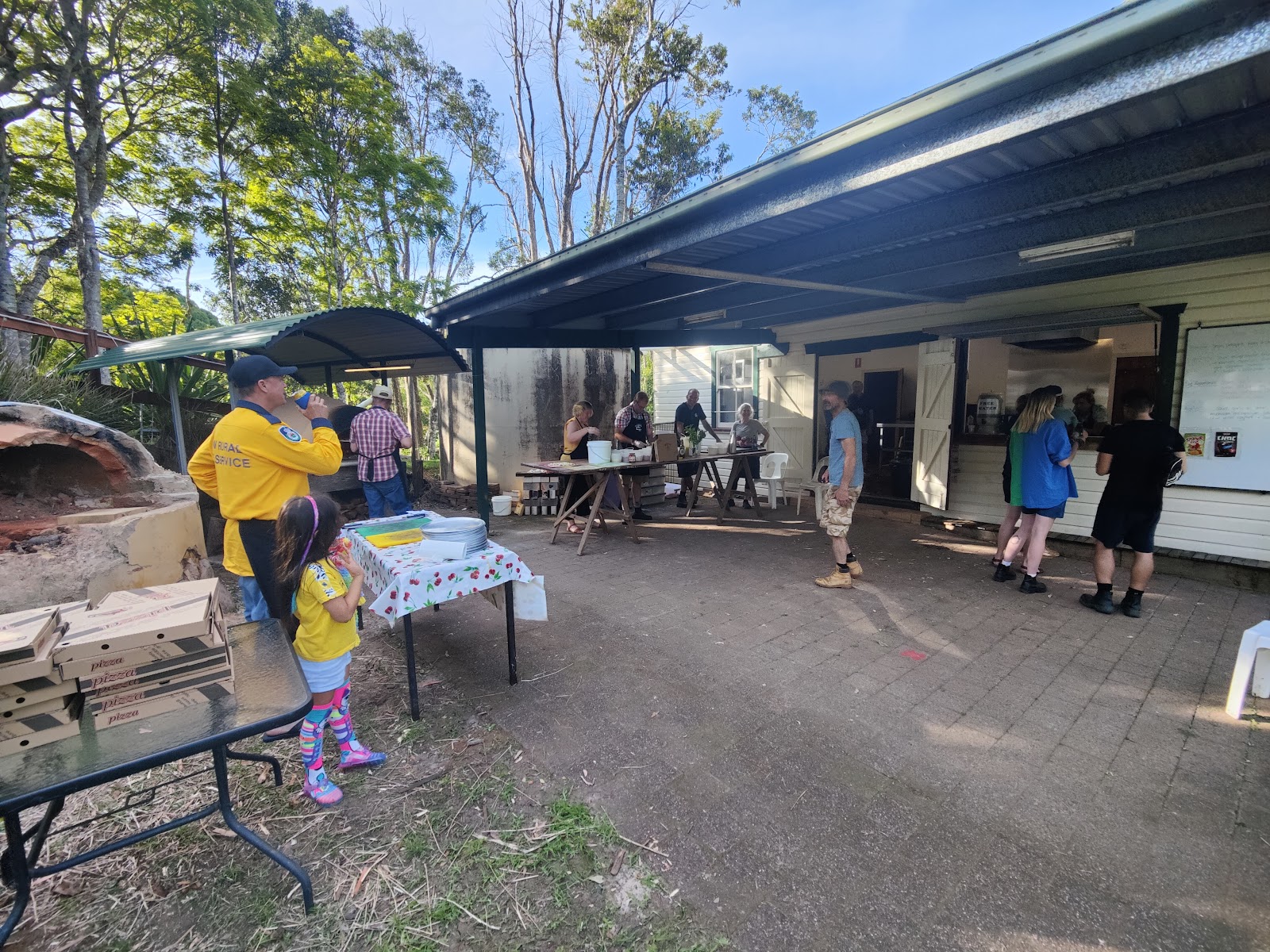 Outdoor servery and pizza oven in daylight